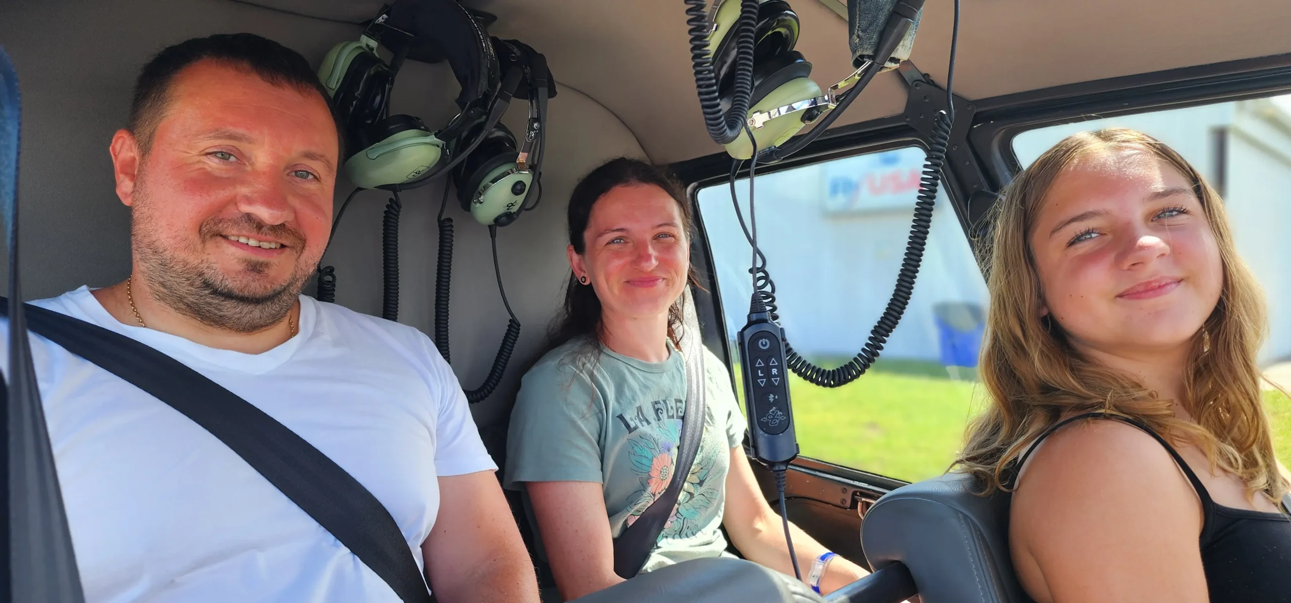 Happy guest celebrating beside the Vertical Flight helicopter